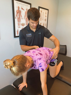 Dr. Speer giving treatment to a youth athletes