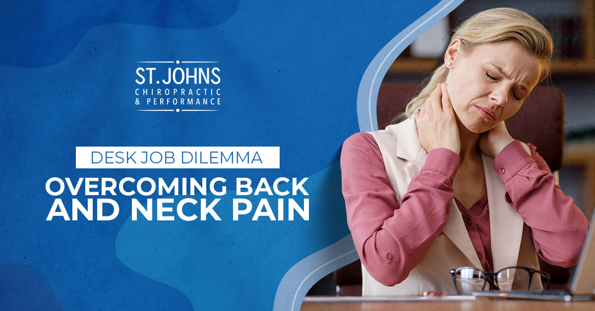 Woman Sitting At A Desk Grabbing Her Neck In Pain | Desk Job Dilemma: Overcoming Back and Neck Pain | St. Johns Chiropractic & Performance