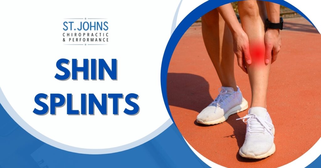 A Runner With White Shoes Grabbing Their Shins in Pain | Shin Splints Treatment | St. Johns Chiropractic & Performance